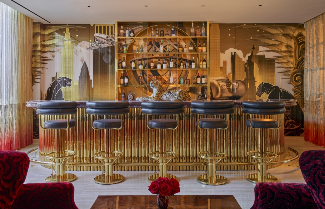 The Living Room, a stylish open bar with gold adornments, at Faena New York