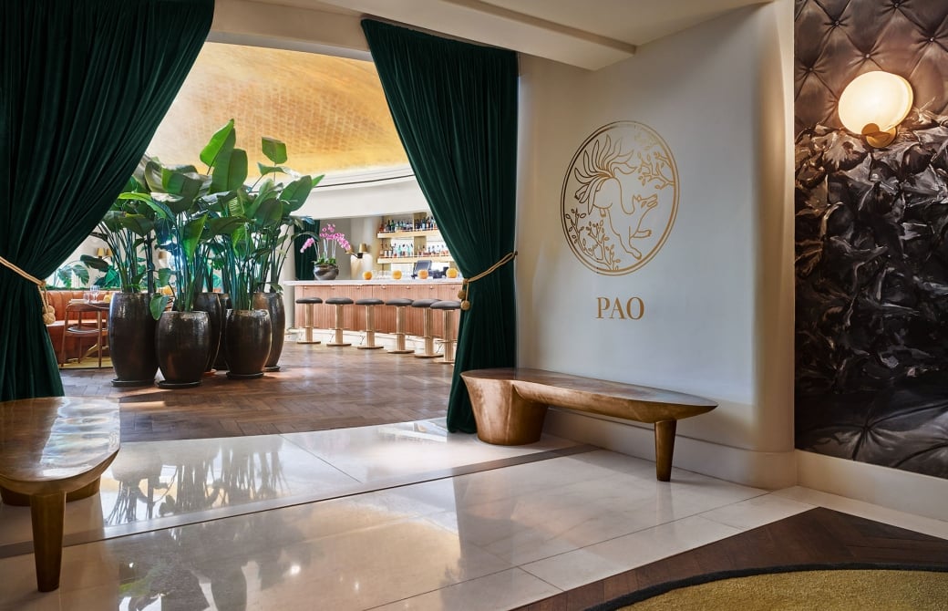 entrance to Peo with benches and tall plants