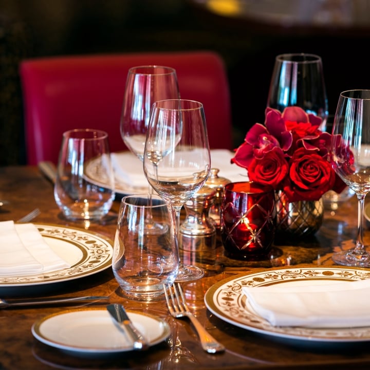 Table setting with plates and wine glasses