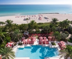 Aerial view of hotel pool on the edge of beach