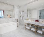 hotel bathroom with large stand alone bathtub