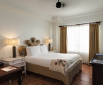 hotel bedroom with bed fitted with white linens