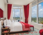bedroom in hotel with large windows on two sides