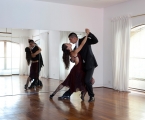 two couples dance the tango