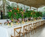 Dining area under burlap canopy