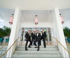 Groomsman standing on staircase