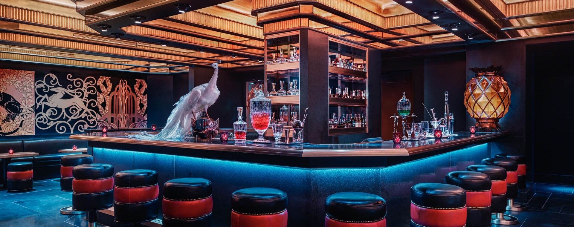 a bar with stools and a counter