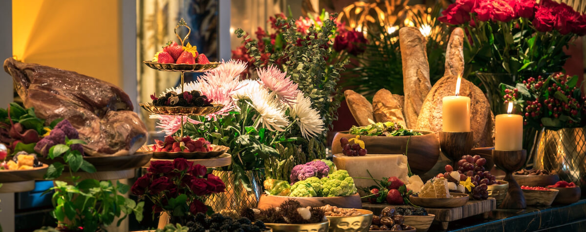 A lavish buffet spread with various dishes and decorations.