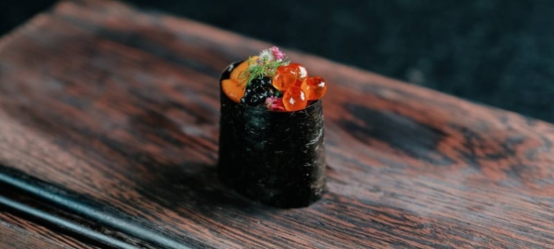 seaweed wrapped sushi with caviar on top