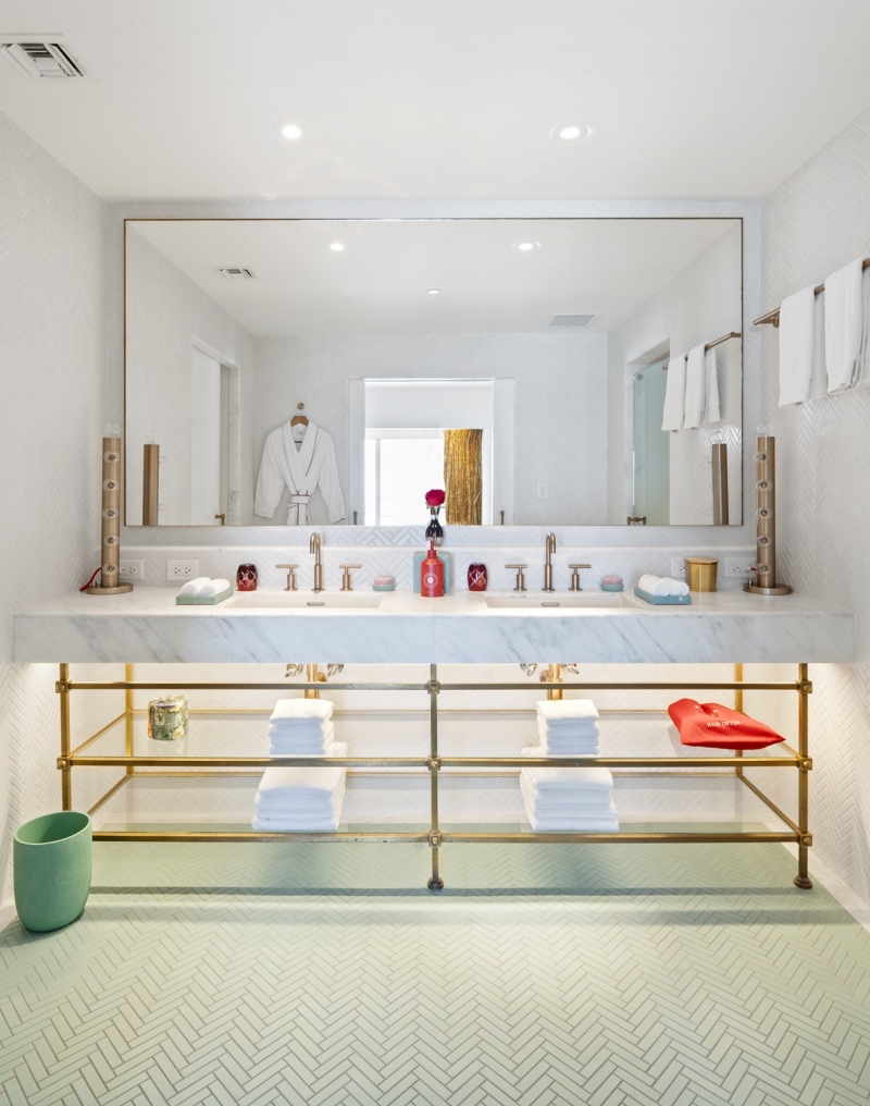 Bathroom with large two sink vanity with shelves underneath