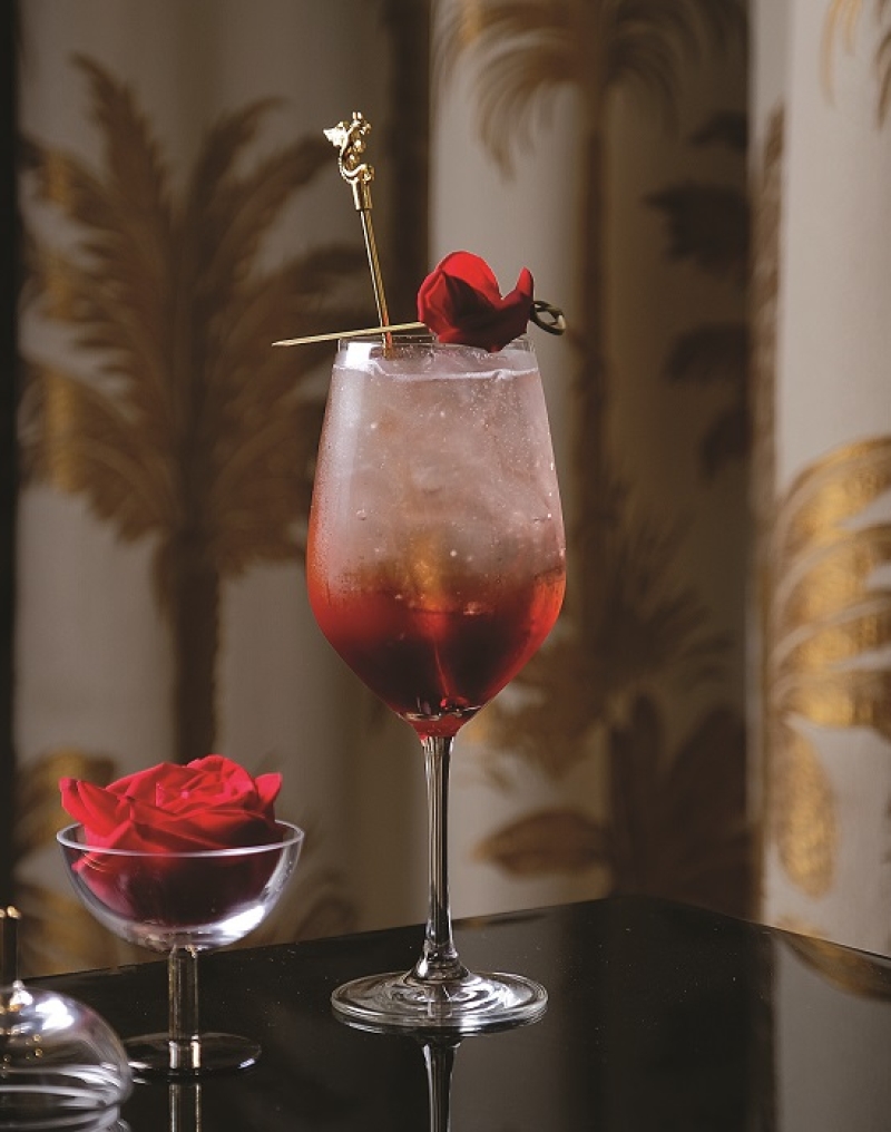 Cocktail garnished with a rose