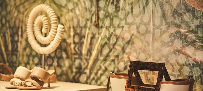 Shoes and accessories displayed on pedestals 
