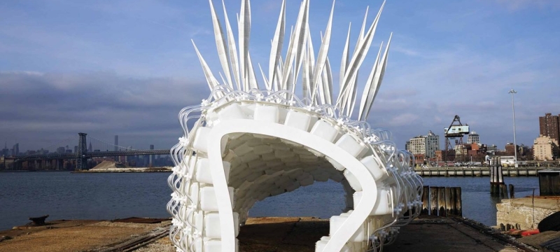 Art sculpture by a body of water