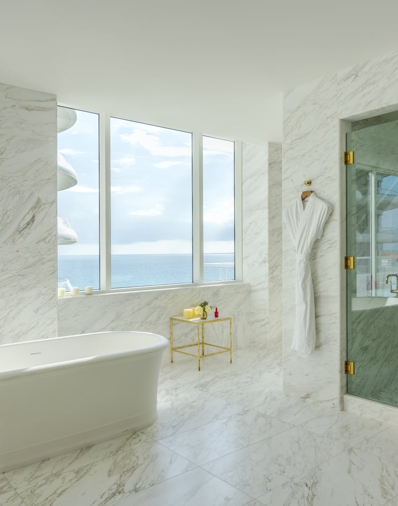 hotel bathroom with large stand alone bathtub