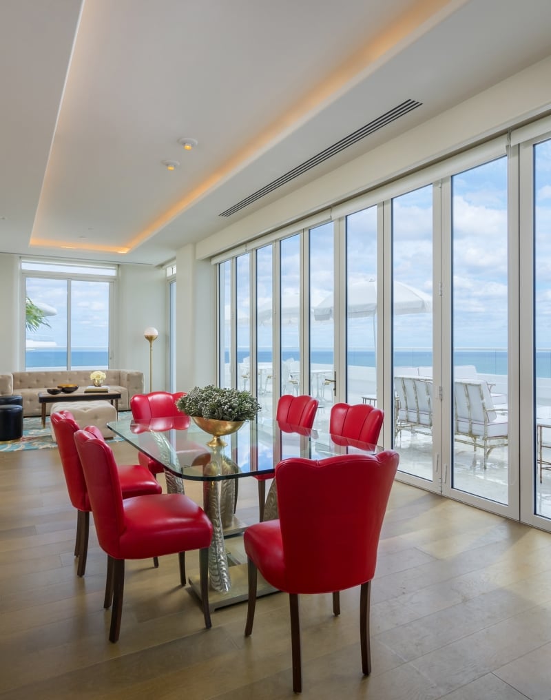 dining area in hotel penthouse with a wall of windows