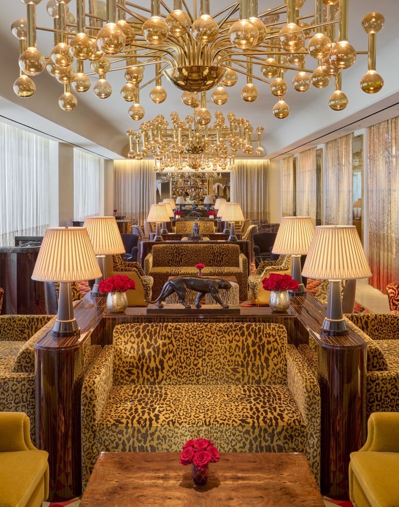The Living Room, a stylish open bar with gold adornments, at Faena New York