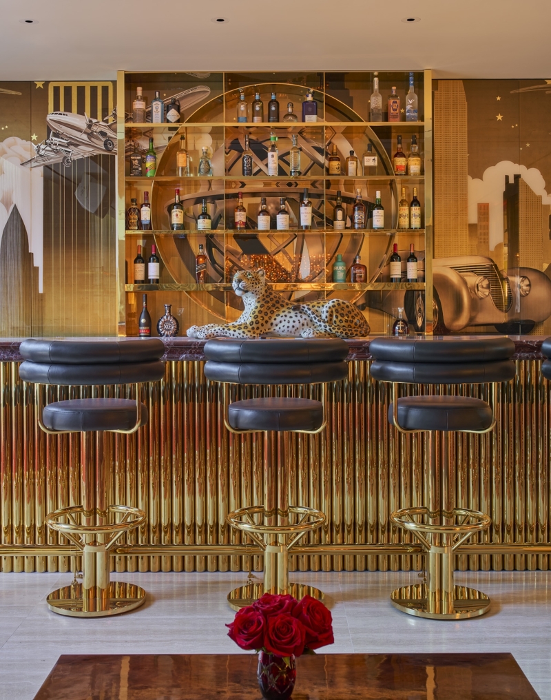 The Living Room, a stylish open bar with gold adornments, at Faena New York