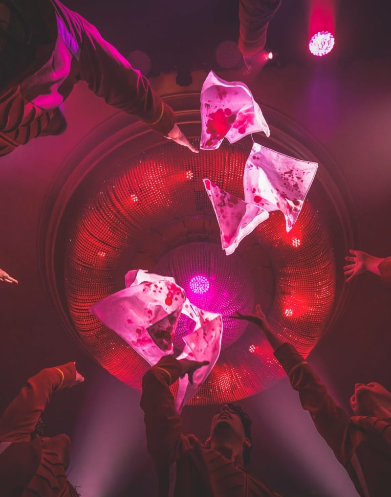 People throwing clothes up in the air