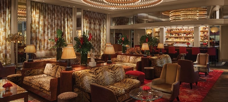 bar and lounge area filled with animal print couches