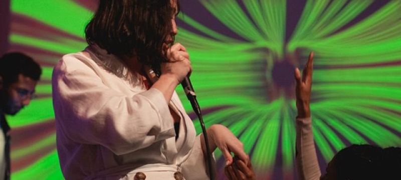 Morgan Bryson signs into microphone