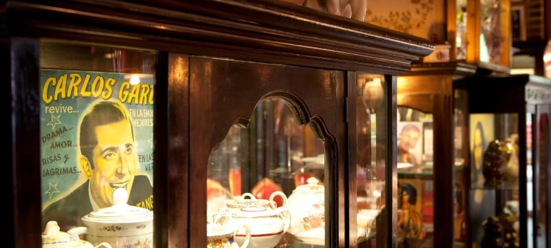 interior shot of cabinet with shelves full of ornate dishware