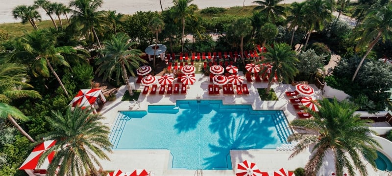 Aerial view of hotel pool on the edge of beach