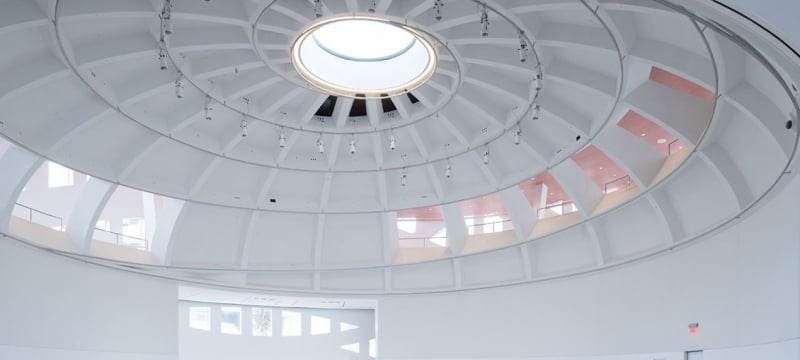 indoor ceiling shot of white sphere-shaped building 