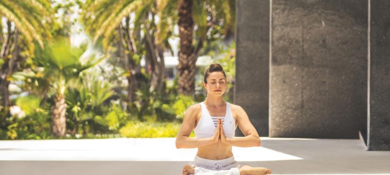 Woman in lotus pose meditating
