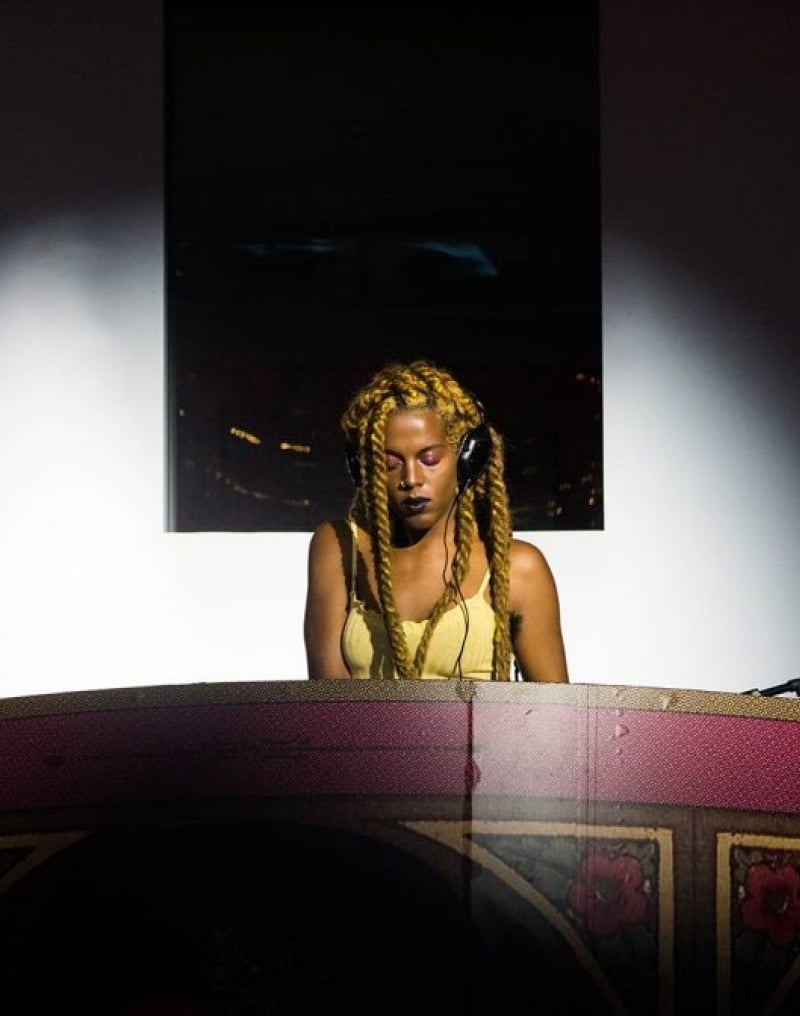 Juliana Huxtable performs in red booth