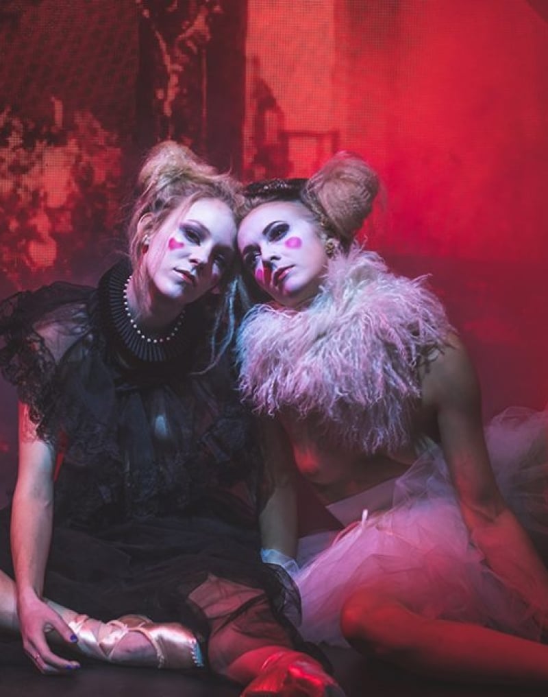 Two women performers on stage