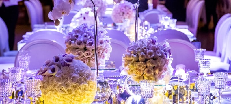 close up of white flowers on table setting
