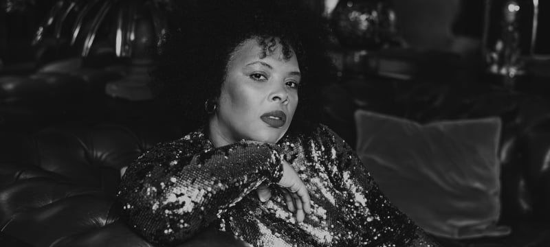black and white woman sitting on the couch