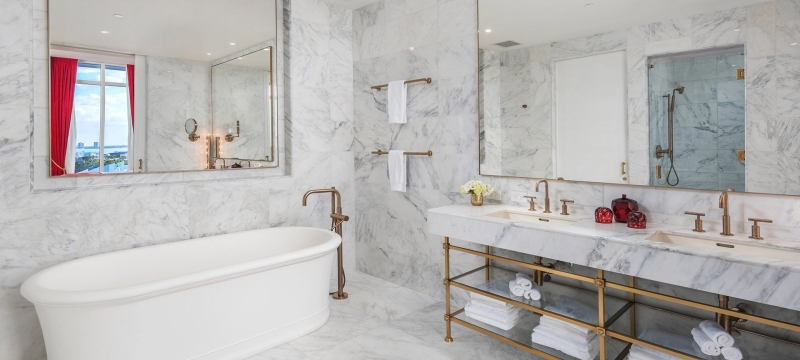 hotel bathroom with large stand alone bathtub