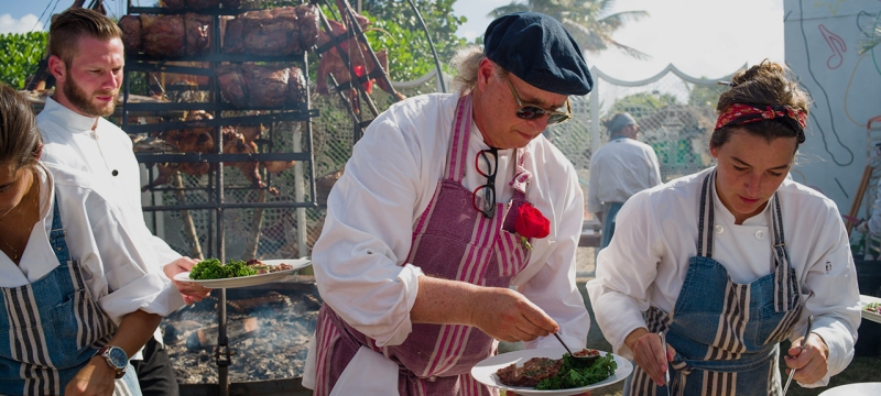 francis mallmann cooking outdoors with assistants