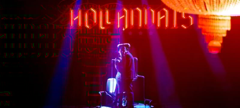 man and woman kiss on stage