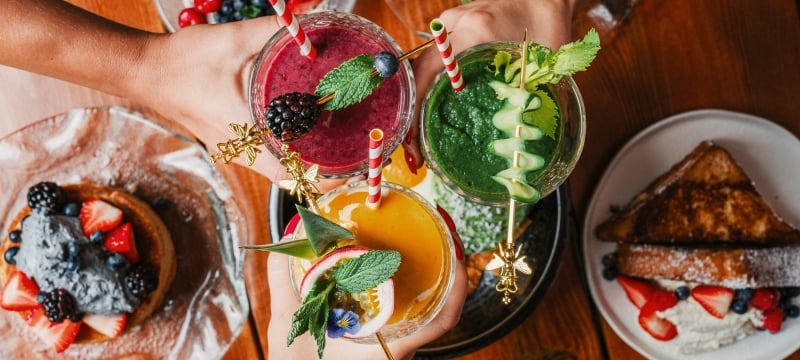 Tropical refreshing smoothies and assortment of breakfast