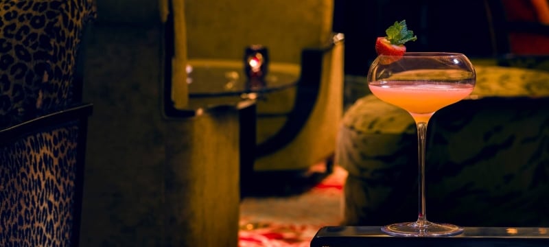 cocktail with strawberry garnish