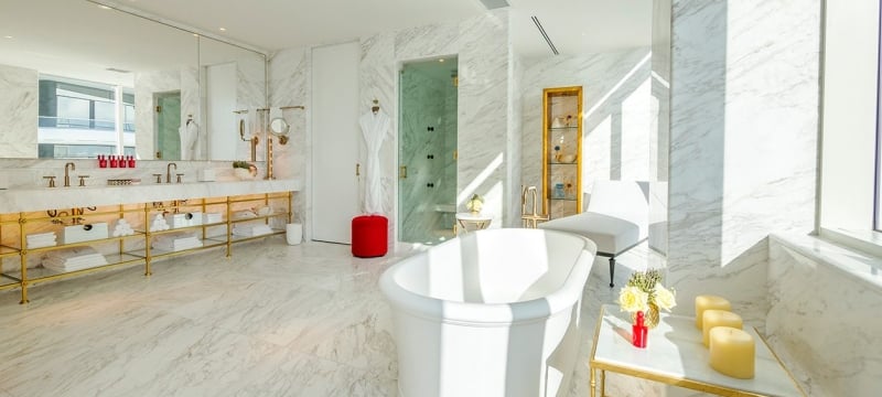 hotel bathroom with large stand alone bathtub