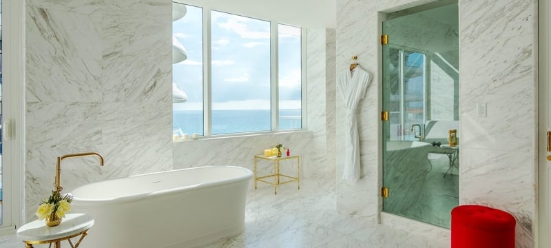 hotel bathroom with large stand alone bathtub