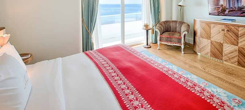 faena suite hotel bedroom overlooking the beach