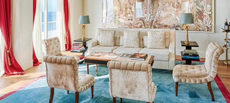 couch and four chairs in faena hotel suite