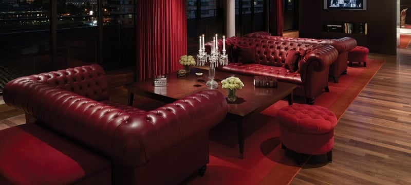 living room with leather couches in hotel suite