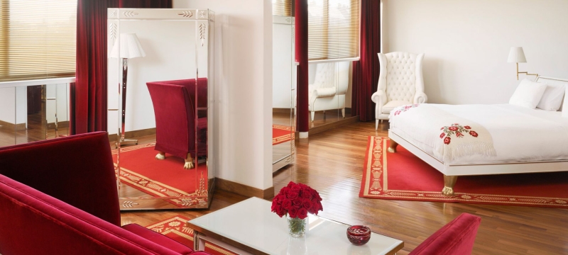 hotel suite with bed and seating area