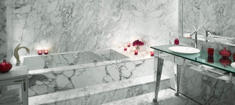 marble bathtub and sink area in hotel suite